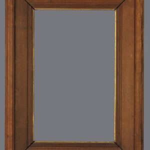 A wooden frame with gold trim on the top.