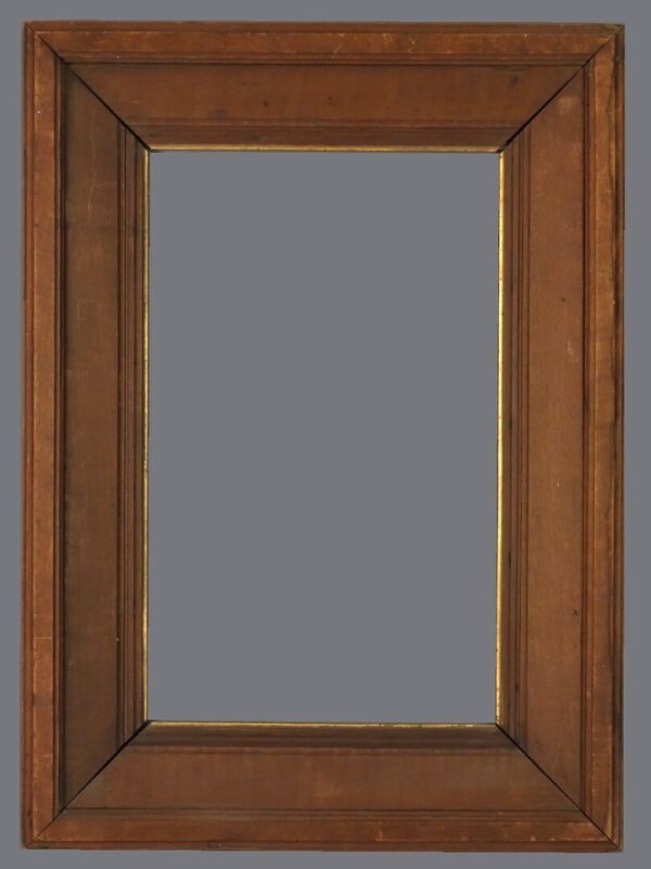 A wooden frame with gold trim on the top.