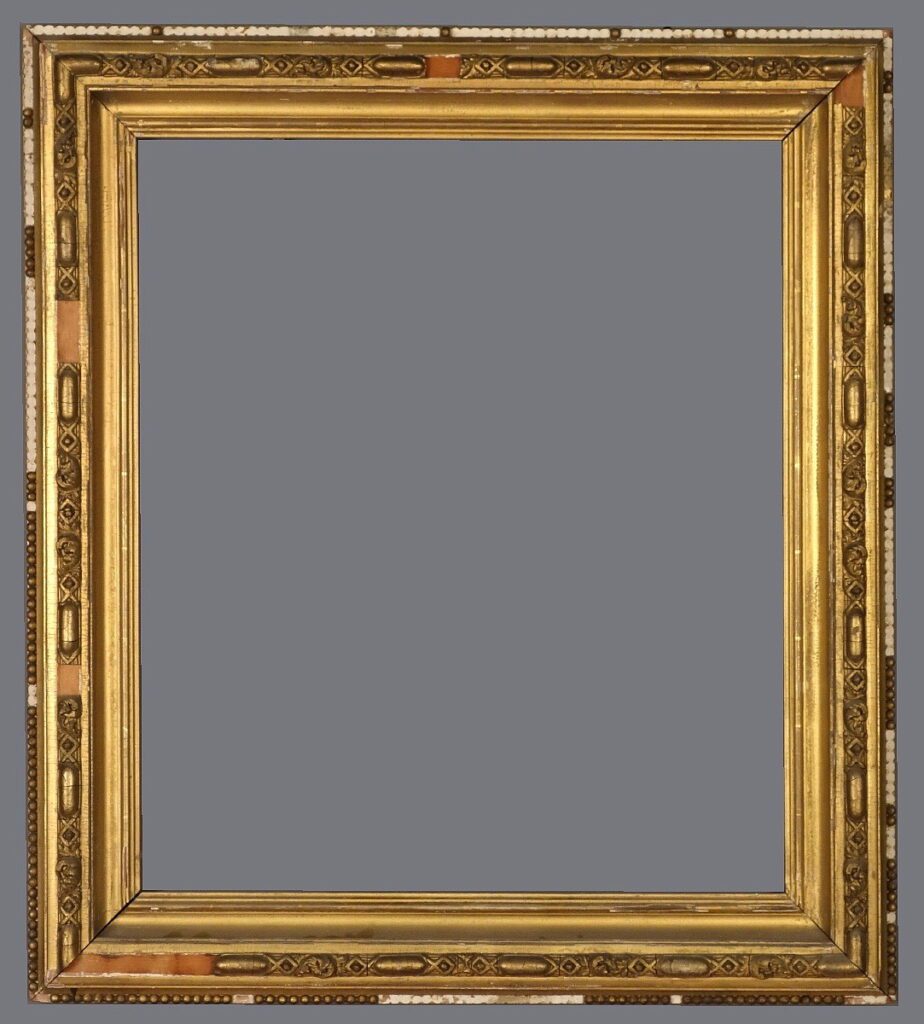 A picture frame with a gold leaf finish.