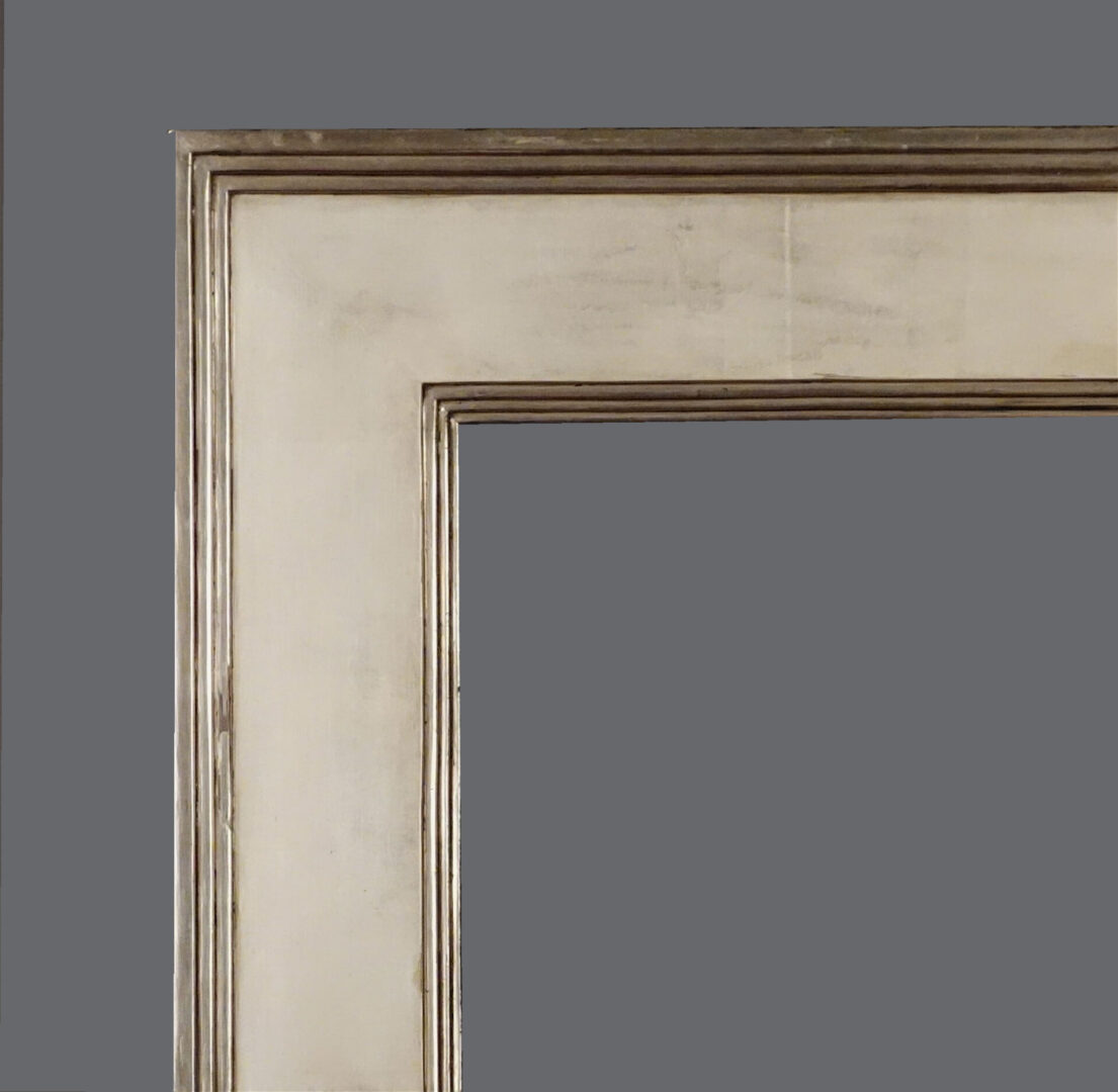 A picture frame with a white background and some brown trim.