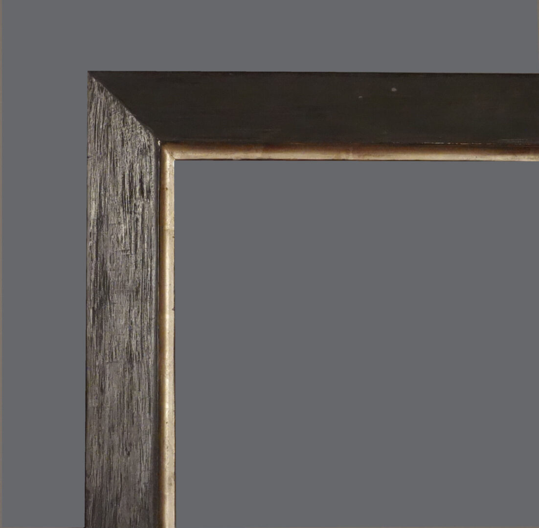 A picture frame with a gray background and some wood.