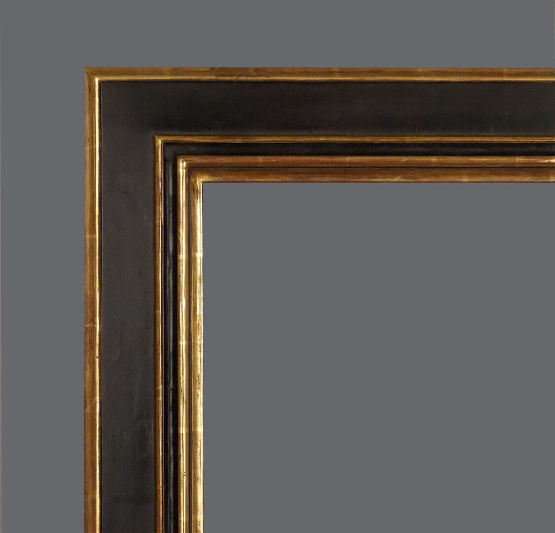 A picture frame with two different colors of wood.