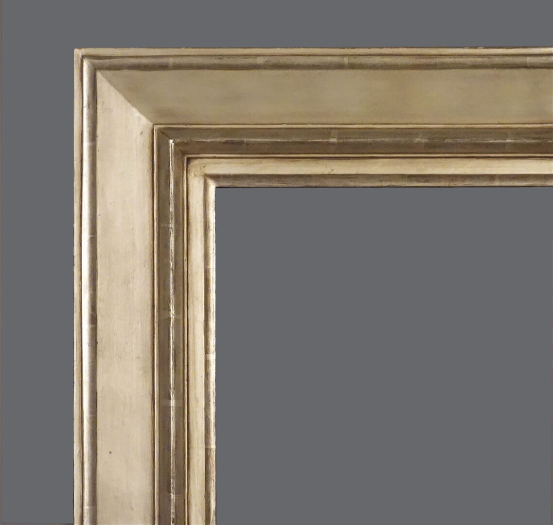 A picture frame with a gray background and silver trim.