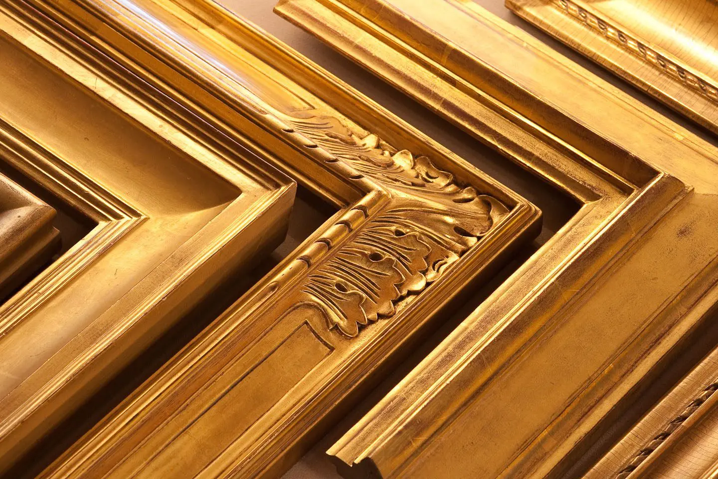 A close up of some gold frames on top of each other