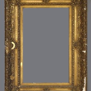 A large gold frame with ornate carvings and a gray background.