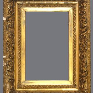 A gold frame with some faces on it