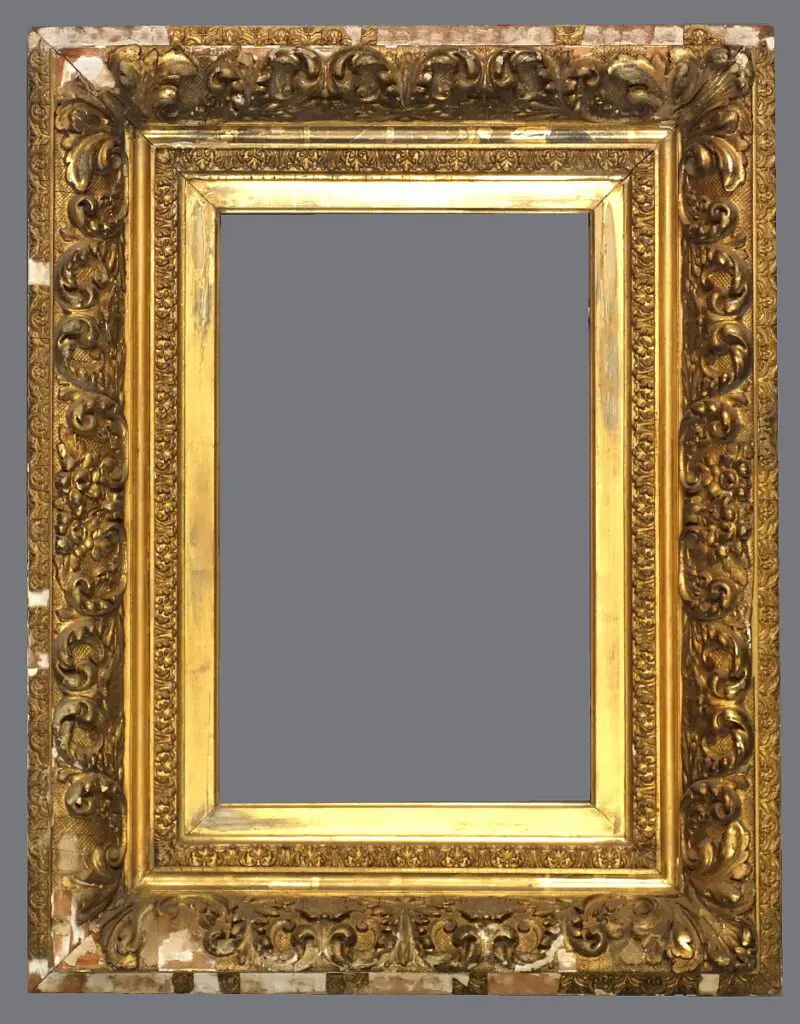 A gold frame with some faces on it