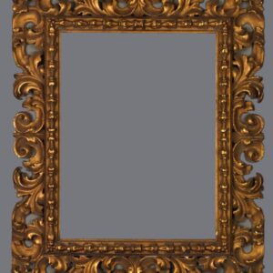 A picture frame with gold leaf and ornate design.