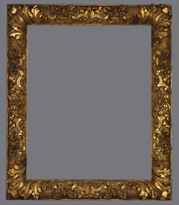 A picture frame with gold leaf and a gray background.