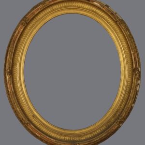 A gold oval picture frame with gray background