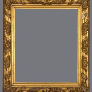 A picture frame with gold leaf and a gray background.