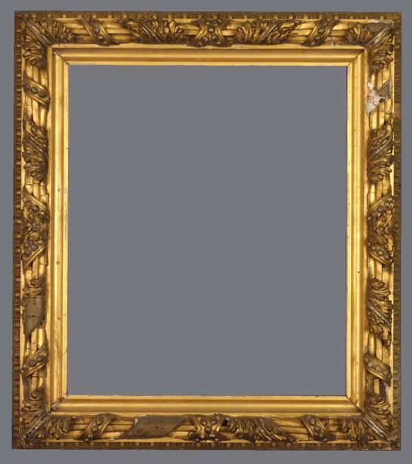 A picture frame with gold leaf and a gray background.