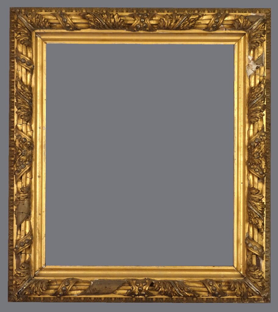 A picture frame with gold leaf and a gray background.