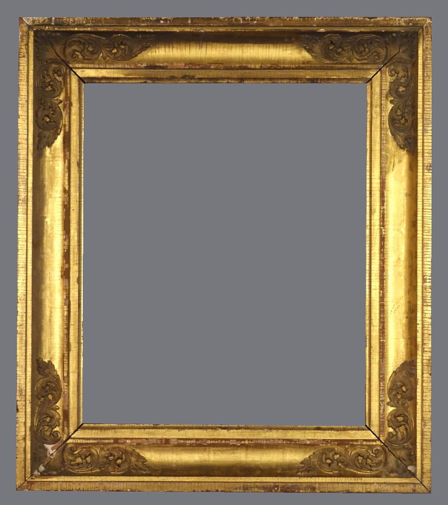 A picture frame with gold leaf and a gray background.