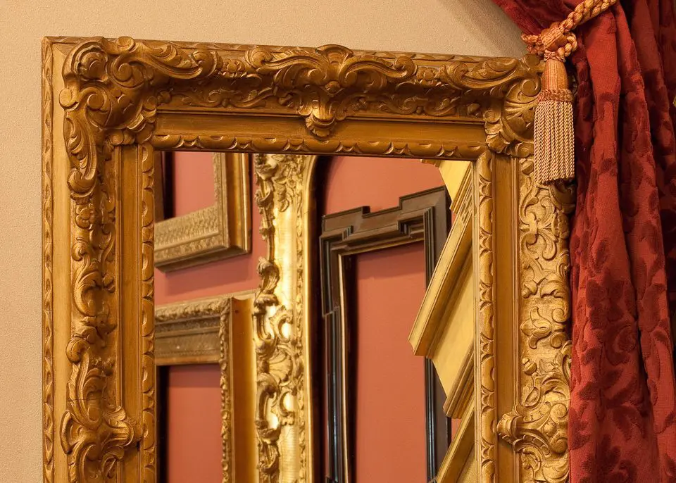 A mirror with two different frames on it