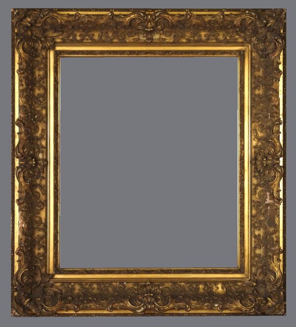 A picture frame with gold leaf and a gray background.