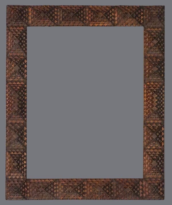 A picture frame with an intricate design on it.