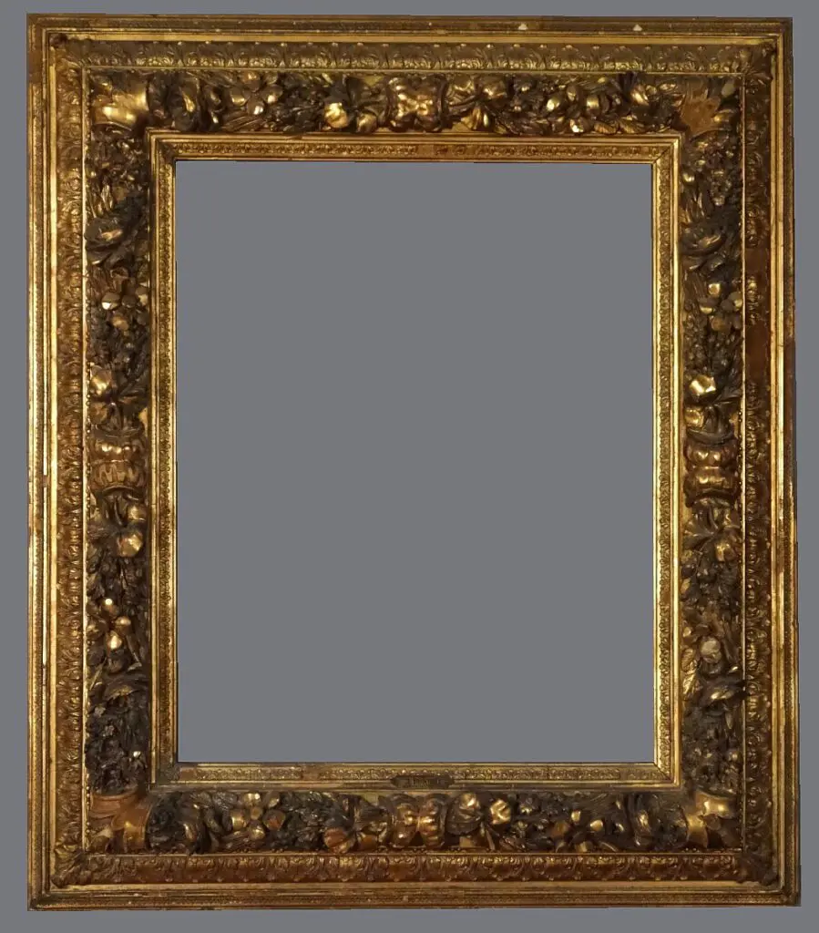 A picture frame with gold leaf and brown paint.