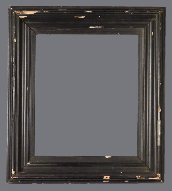 A picture frame with an old look and a gray background.