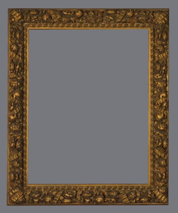 A picture frame with gold leaf and a gray background.