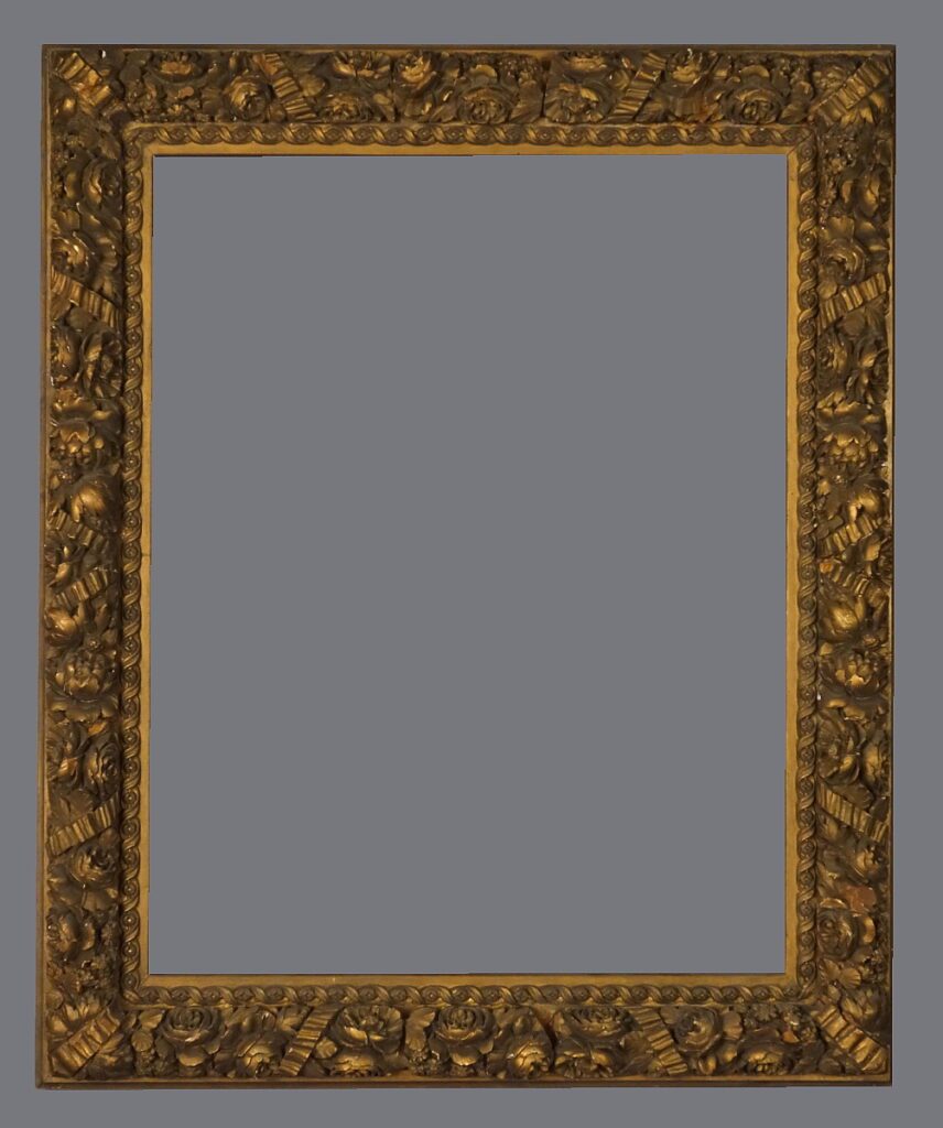 A picture frame with gold leaf and a gray background.