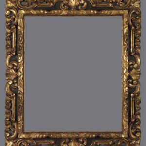 A picture frame with gold leaf and black trim.