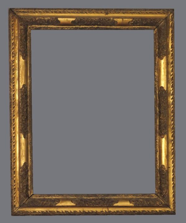 A picture frame with gold leaf and a gray background.