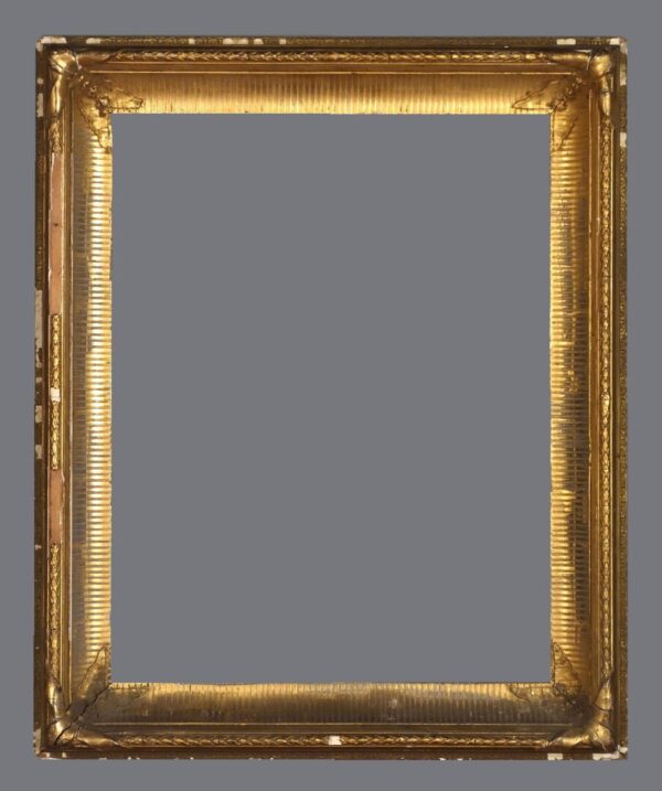 A picture frame with gold leaf on the edges.