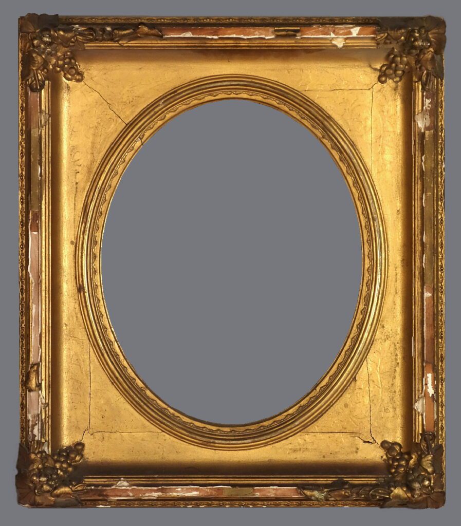 A gold frame with an oval mirror in the center.