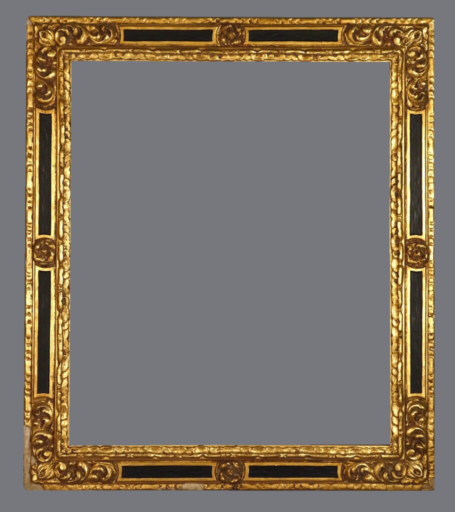 A gold frame with black and brown trim.