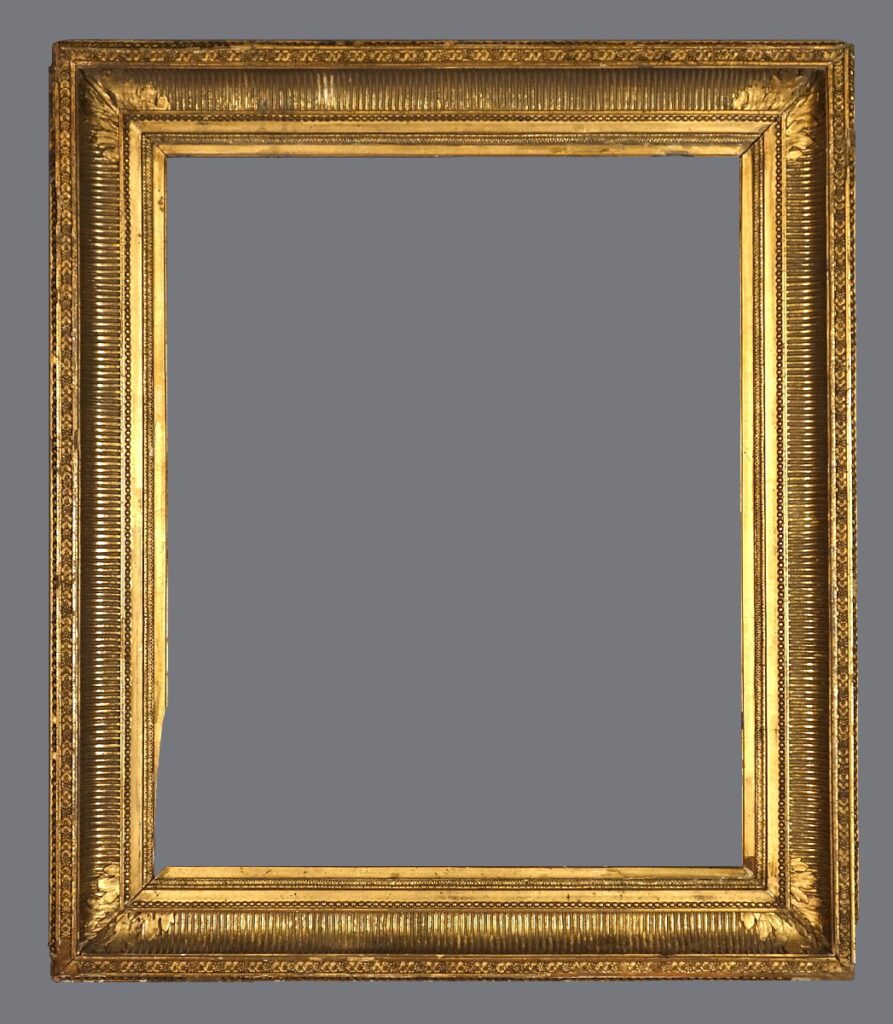 A picture frame with gold leaf on the edges.