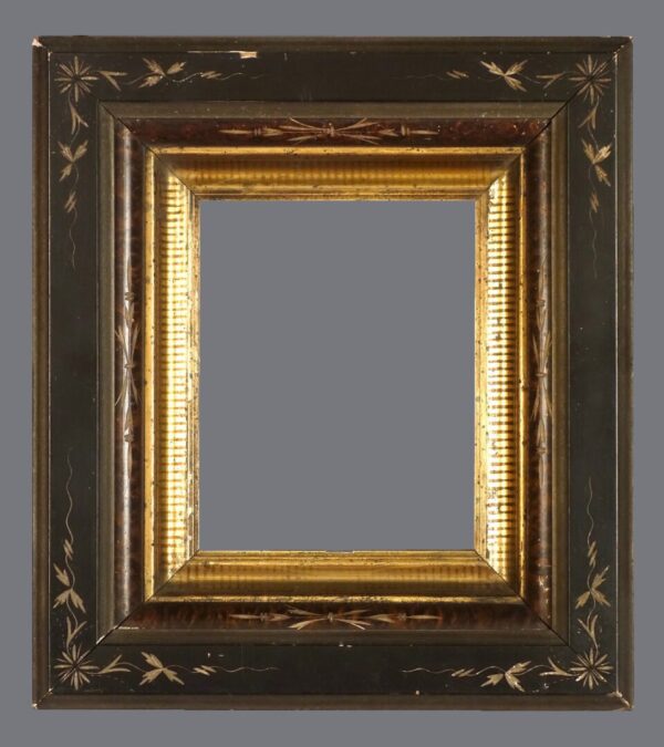 A picture frame with gold leaf and black trim.