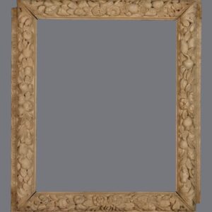 A picture frame with many small shells on it.