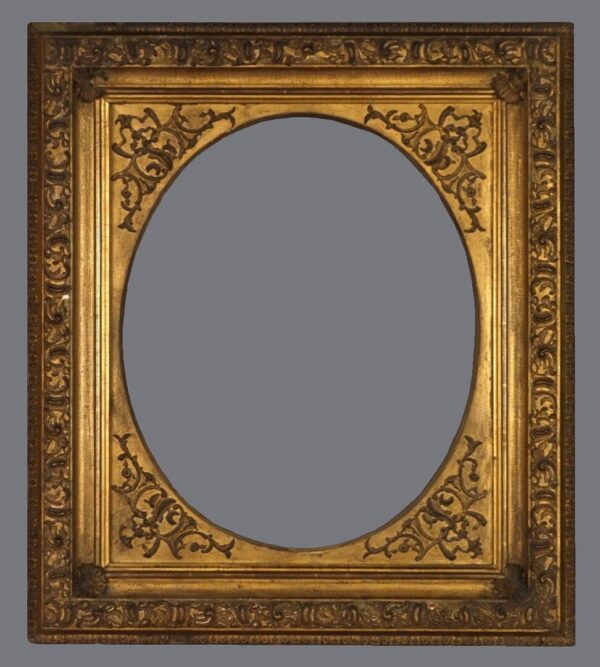 A gold frame with a floral design on it.