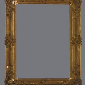 A picture frame with gold leaf and ornate design.