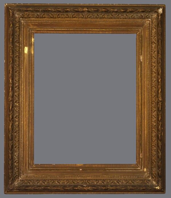 A picture frame with gold leaf and a gray background.