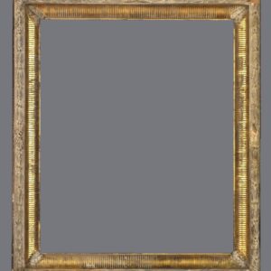 A picture frame with gold leaf on the edges.