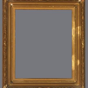 A picture frame with gold leaf and a gray background.