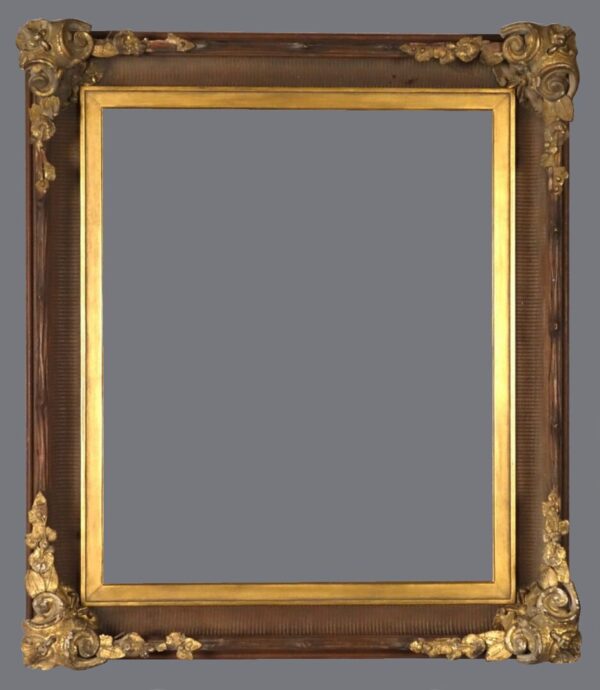 A picture frame with gold leaf trim and a gray background.