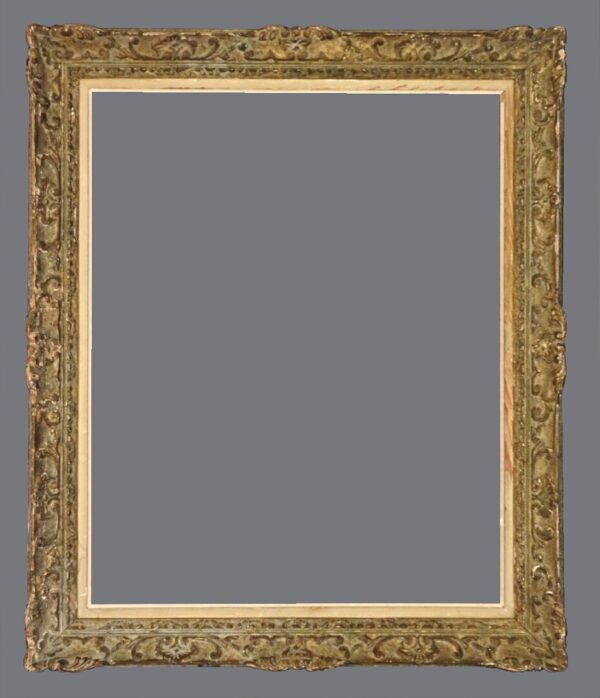 A picture frame with gold leaf and a gray background.