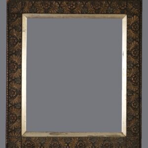 A mirror with a gold frame and a black background