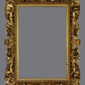 A gold frame with some faces on it