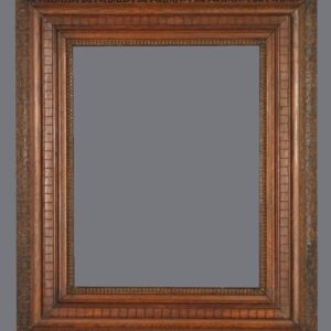 A picture frame with an ornate wood border.