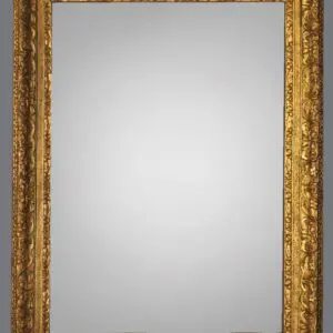 A gold framed mirror with a white background