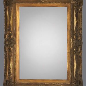 A mirror with gold frame and a gray background