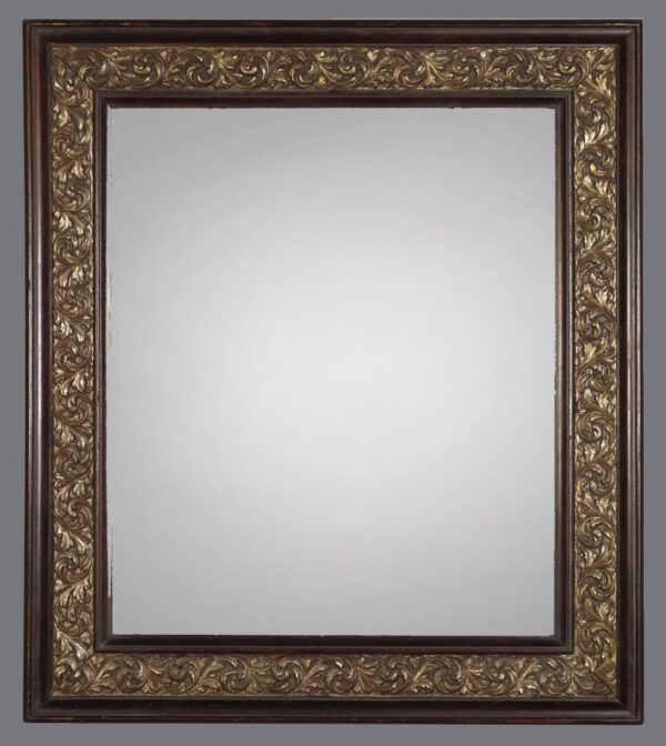 A mirror with gold leaf frame and white background.