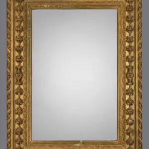 A mirror with gold frame and white background