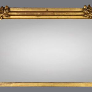 A gold mirror with two large wooden frames.