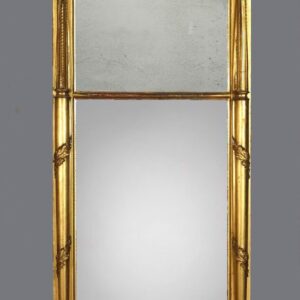 A gold mirror with two mirrors on the side.