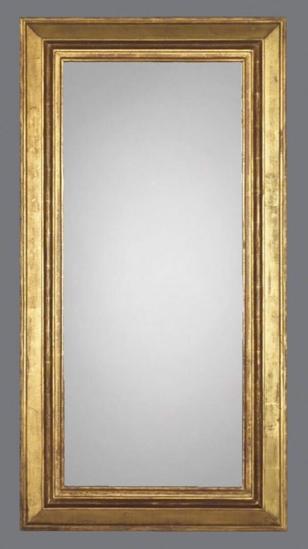 A large gold mirror with a wooden frame.